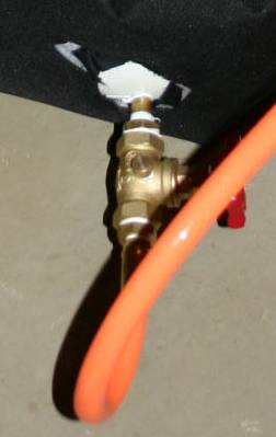 Picture of the connection of the hose to the water tank.